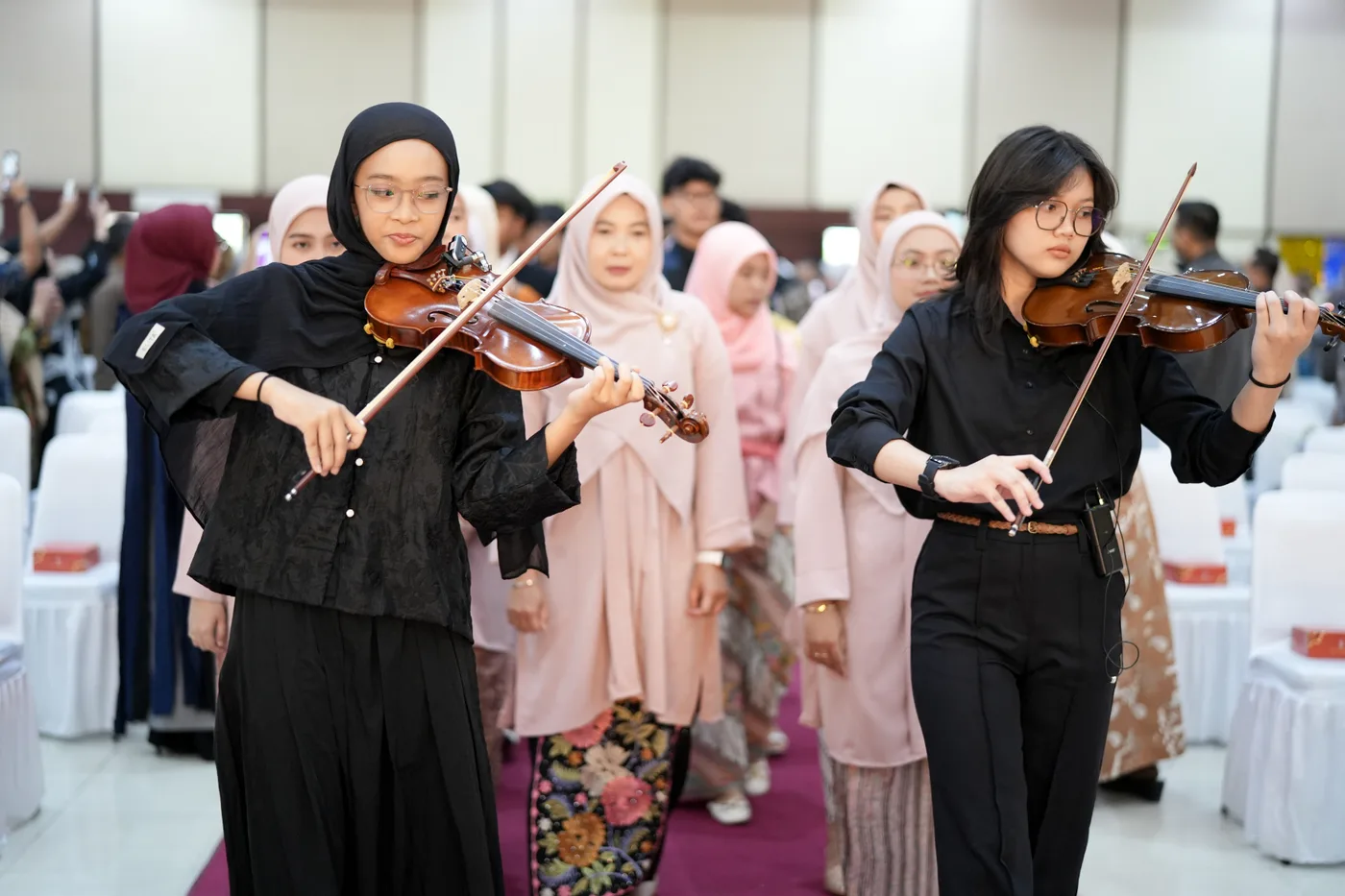 Violin performance by students accompanying the school graduation procession